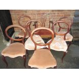 A set of six Victorian balloon back chairs + one other