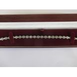 An 18ct white gold tennis bracelet