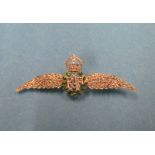 An unmarked but tested 18ct gold green enamel and diamond RAF lapel sweetheart brooch