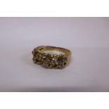 A 9ct gold ring set with 7 diamonds, approx weight 5.1g