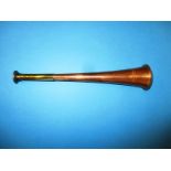 A vintage Boosey & Hawkes hunting horn
