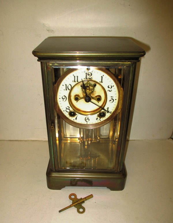 A four glass mantel clock with Brocot escapement and enamel dial