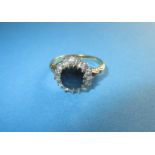 An 18ct gold diamond and sapphire ring