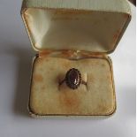 An antique gold ring set with garnets