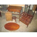 An antique oak side table, a butler tray a stool and a Canterbury