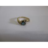 A 9ct gold ring set with a single tourmaline