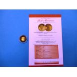A 2005 gold proof miniature £1 coin, with certificate