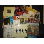 A quantity of 12inch vinyl records to include Help & Sgt Pepper by the Beatles and Shaved Fish by