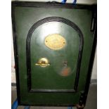 A vintage floor standing safe and key by T Withers & Son
