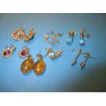 7 pairs of gold, stone set drop earrings