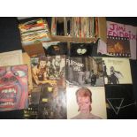 A quantity of 7 & 12 inch vinyl records to include examples by the Beatles and David bowie