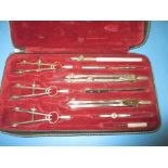 A cased set of drawing instruments