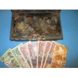 A quantity of vintage coins and bank notes