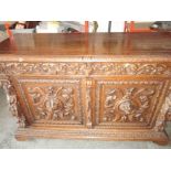 A Victorian profusely carved sideboard with lion mask decoration