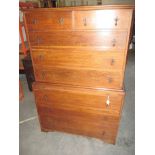 An oak chest on chest of 2 short over 7 long drawers