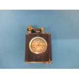 A 1920s clock cigarette lighter marked Elem