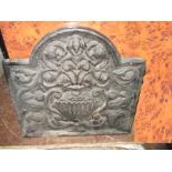 A 19th century cast iron fire back