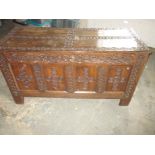 A large 18th century oak coffer having 19th century embellishment