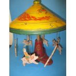 An early 20th century tin plate carousel