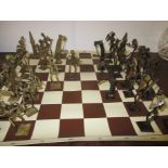 An African Ashanti bronze chess set on later playing mat