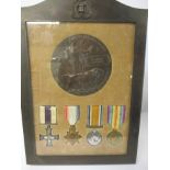 A group of 4 WWI medals to include the MC. in frame with Memorial plaque all to Lt. Reginald