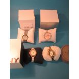 4 boxed designer watches