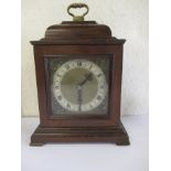 A vintage mahogany mantle clock