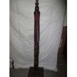 A carved wood torchiere standard lamp body