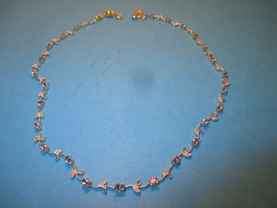 A 14ct gold diamond and tanzanite neck collar