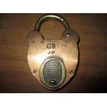 A large antique brass padlock