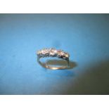 A 5 stone diamond half hoop eternity ring, approx. size M