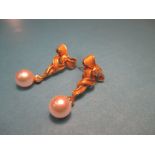 A pair of 18ct gold earrings, each drop set with a single diamond and pearl