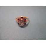 A Ruby, diamond and aquamarine cluster ring, approx. size O