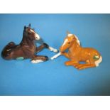 A Beswick Palomino foal number 915 and Shire Horse foal number 2460