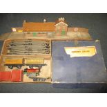 A boxed Hornby Triang '0' gauge clockwork train set and station building