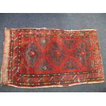 A Persian wool bag rug, approx. size 106x62cm