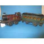 An early 20th century tin plate clock work loco and carriage by GebrÜder Bing