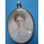 A 19th century mourning portrait miniature with hair locket to reverse