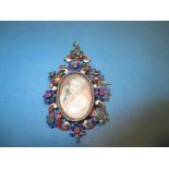 A 19th Century silver pendant with semi-precious stones and enamel and central hand painted