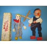 A boxed Pelham clown puppet and one other