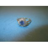 A 9ct gold sapphire and diamond triple row cluster ring, approx. size R1/2