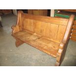 A small vintage pitch pine church pew