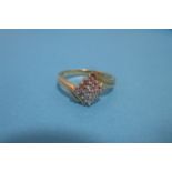 An 18ct gold ring set with 16 diamonds in a square form, approx. size O