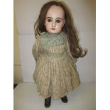 A rare Jumeau size 9 open mouthed doll with original clothing