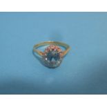 An18ct gold and platinum ring with central aquamarine surrounded by diamonds, approx. size M ½