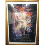 A large framed Star Wars episode one film poster