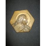 A cast brass church plaque depicting Jesus