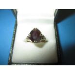 A 9ct gold and garnet ring, approx. size N