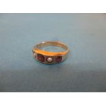 A 9ct gold ring with garnet and seed pearl, approx. size M ½