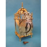 A small mid 20th century Smiths brass lantern clock with key